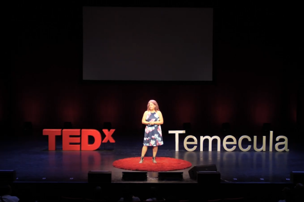 Diane Strand speaking at a creative arts event, empowering students and entrepreneurs through JDS Creative Academy and DigiFest® Temecula in California.