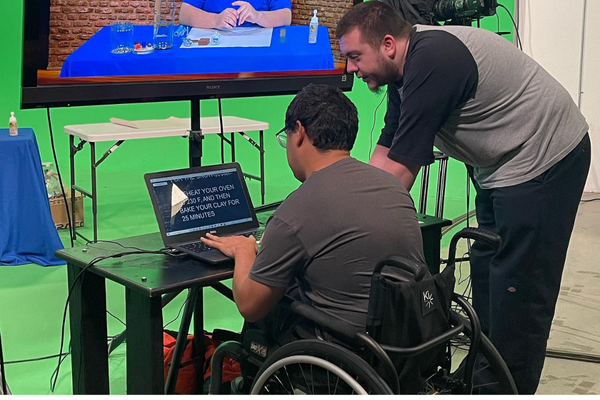 Students collaborating on a digital media project at JDS Creative Academy, learning video production and creative storytelling